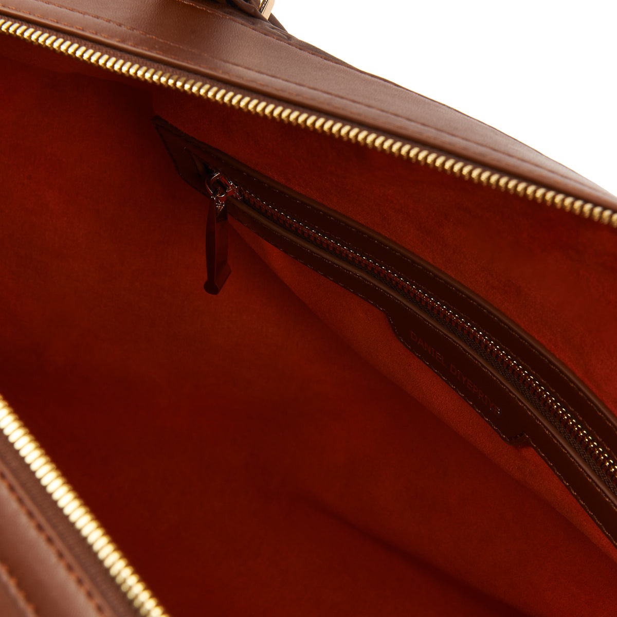 The Abimbola Jigsaw Duffle Bag — Brown Waxed — interior with orange lining and DD zip