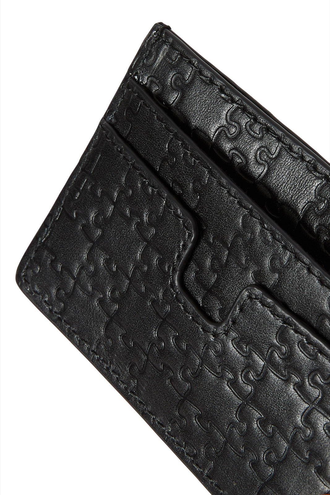 The Bisi Card Holder — Classic Black — jigsaw embossed detail