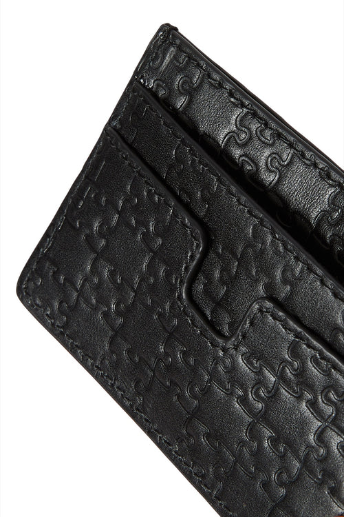 The Bisi Card Holder — Classic Black — jigsaw embossed detail