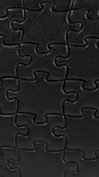 Classic Black · puzzle-embossed lychee leather swatch