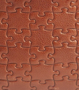 Nkari Brown · puzzle-embossed lychee leather swatch
