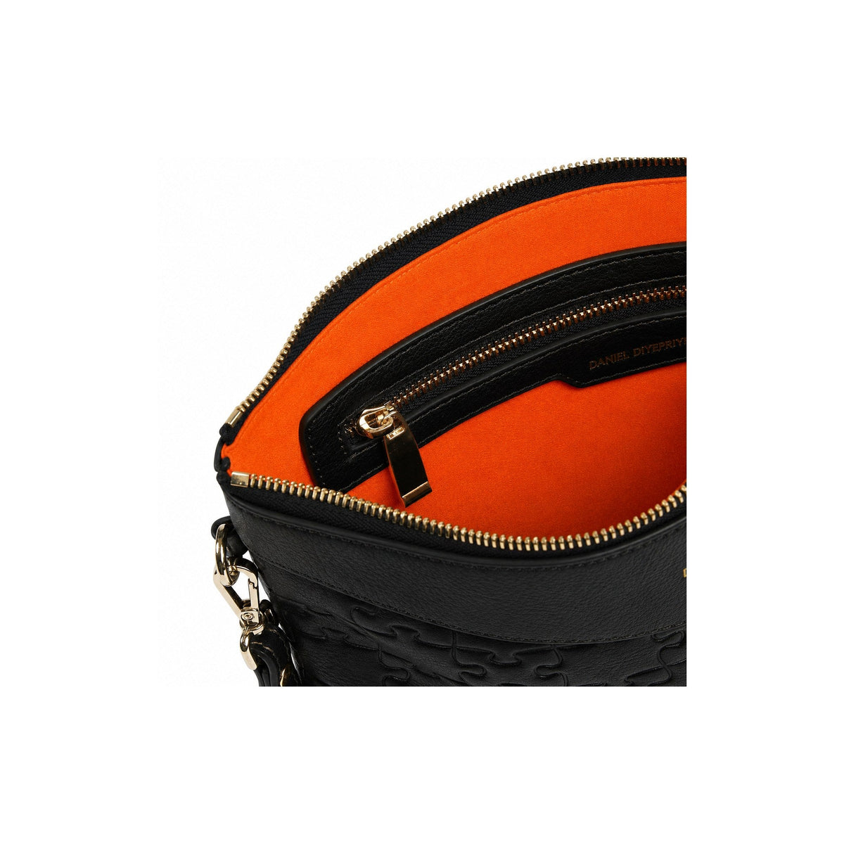 The Tomiwa Jigsaw Clutch Black — interior orange