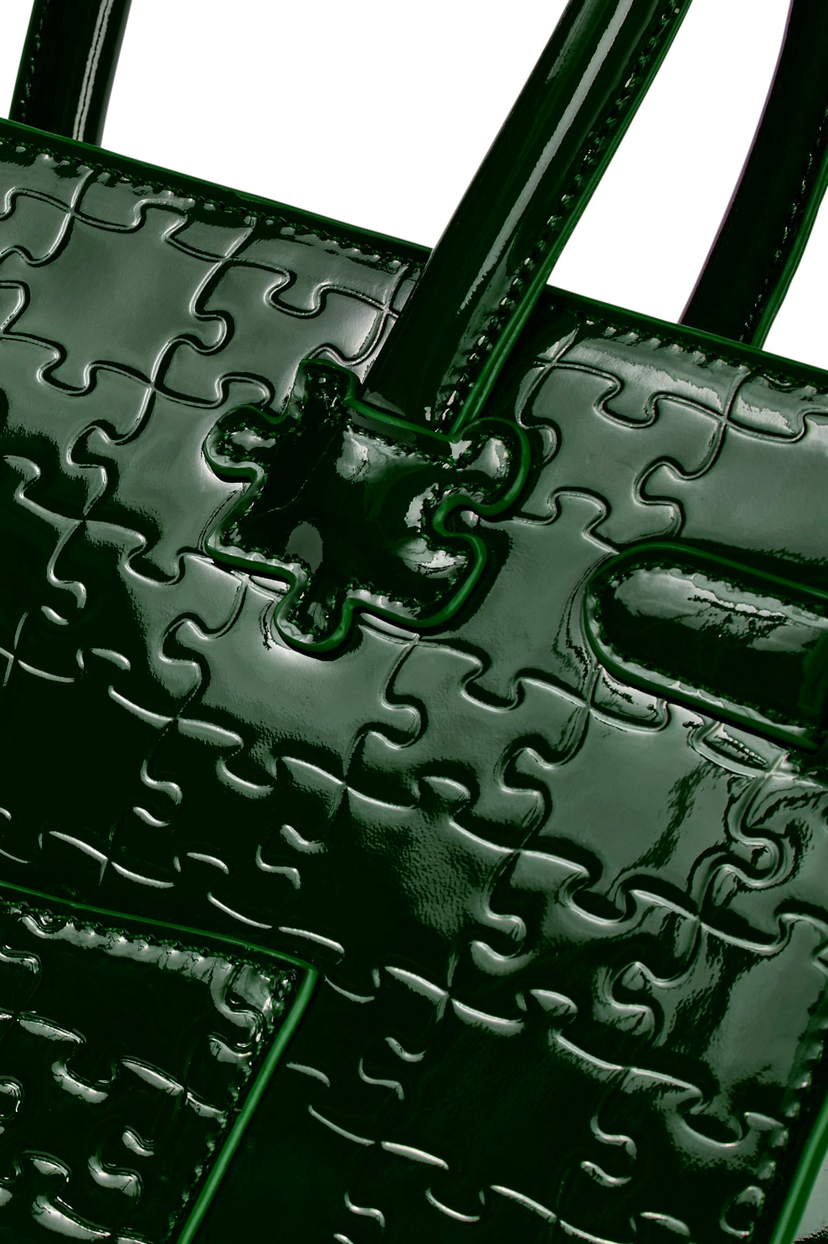 The Ibukun Tote — Forest Green Patent — puzzle-emboss close-up