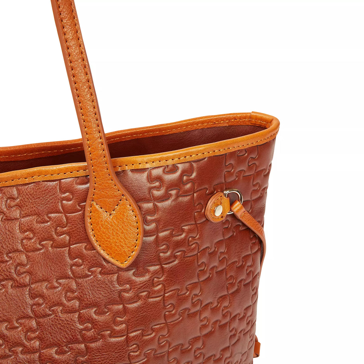 The Nkari Oluwaseun Hopper — handle strap + jigsaw embossed detail