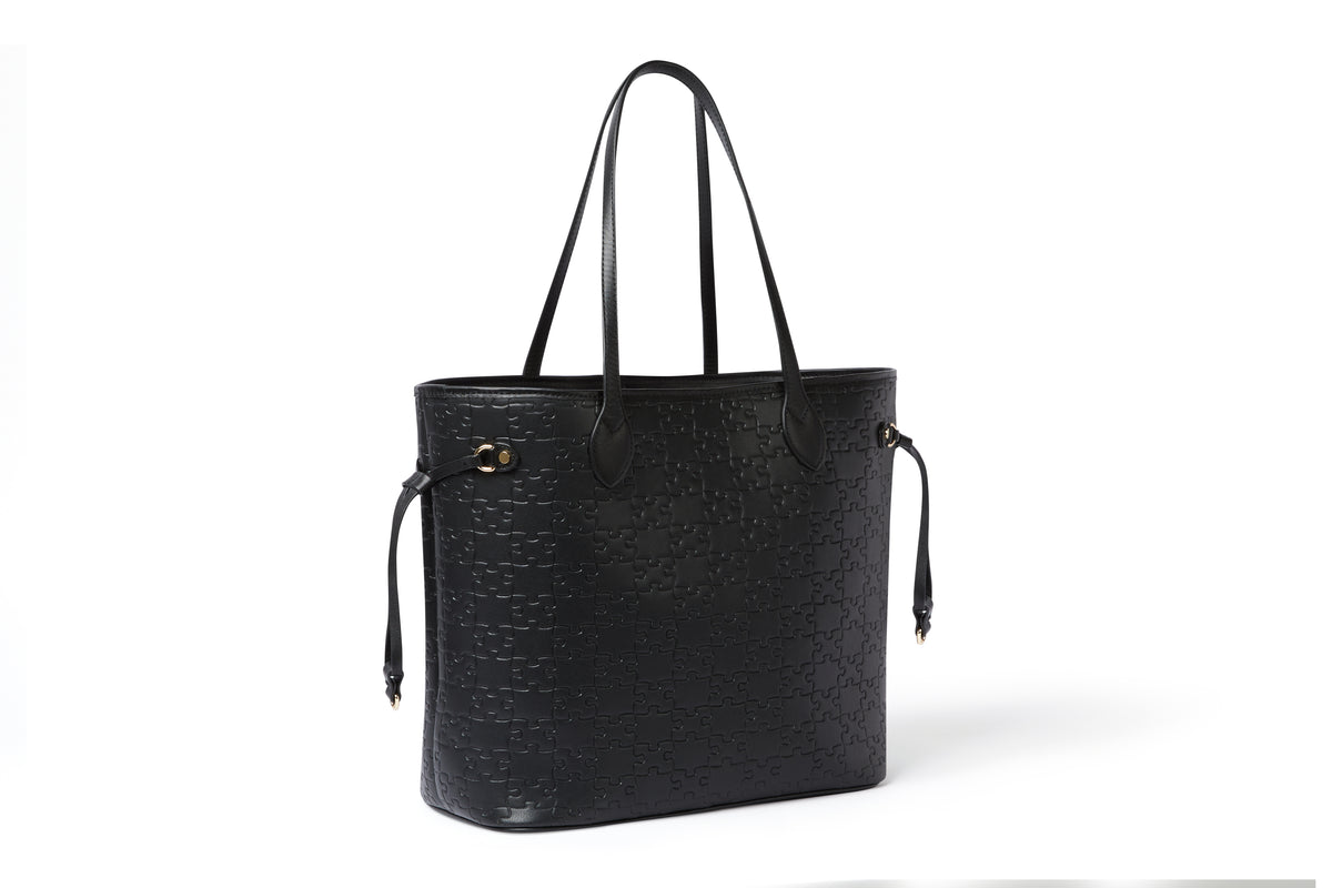 The Nkari Oluwaseun Hopper — Black jigsaw embossed waxed leather — side