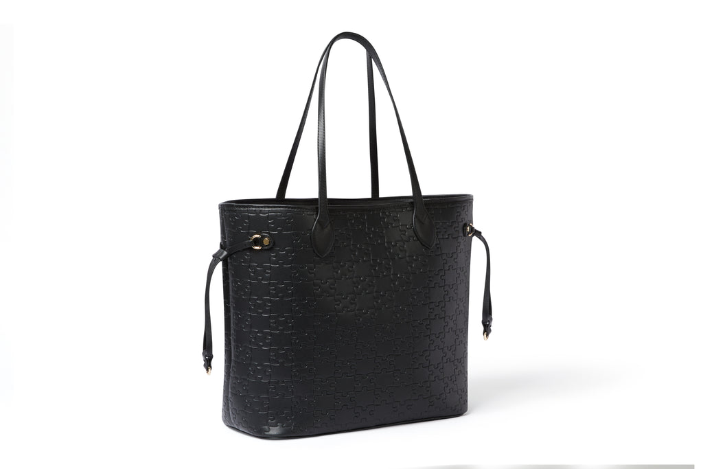 The Nkari Oluwaseun Hopper — Black jigsaw embossed waxed leather — side