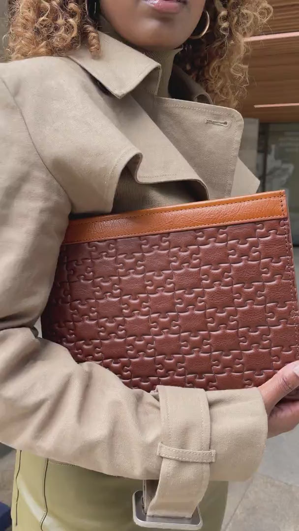 The Nkari Tinuke Tail Clutch · handheld