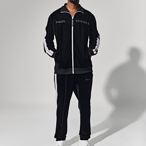 EDITORIAL · NOT A PRODUCT HERO · Man in black tracksuit — do NOT assign as any Duffle variant image — previously mis-labeled 'Classic Black variant'
