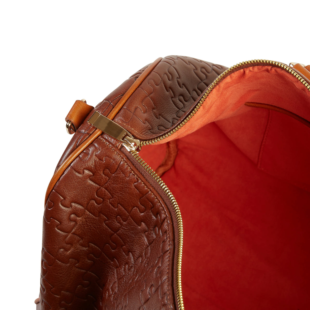 The Abimbola Duffle Bag · Nkari Waxed Brown · orange velvet interior with gold zip detail